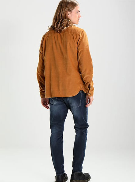 man in light brown shirt - rear view