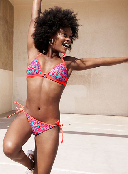 woman wearing an orange and blue bikini swimsuit