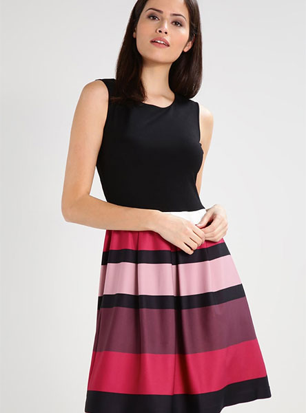 woman in black, brown and red striped dress