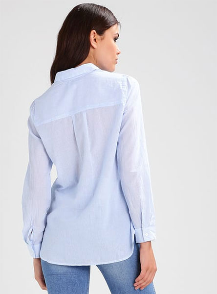 woman in blue shirt rear view