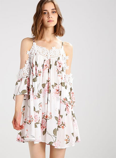 woman in white dress with floral images - front view